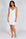 Cannes Pinstripe Chemise in Off White — Petticoat Lane brunette model, studio photograph