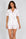 Jolene Short PJ Set in Rose Bubbles — Petticoat Lane brunette model, studio photograph