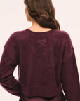 LoveShackFancy Bellaman Pullover in merlot, back view on model