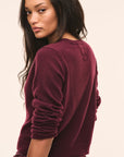 LoveShackFancy Cameryn Cardigan in roasted pomegranate, back view on model